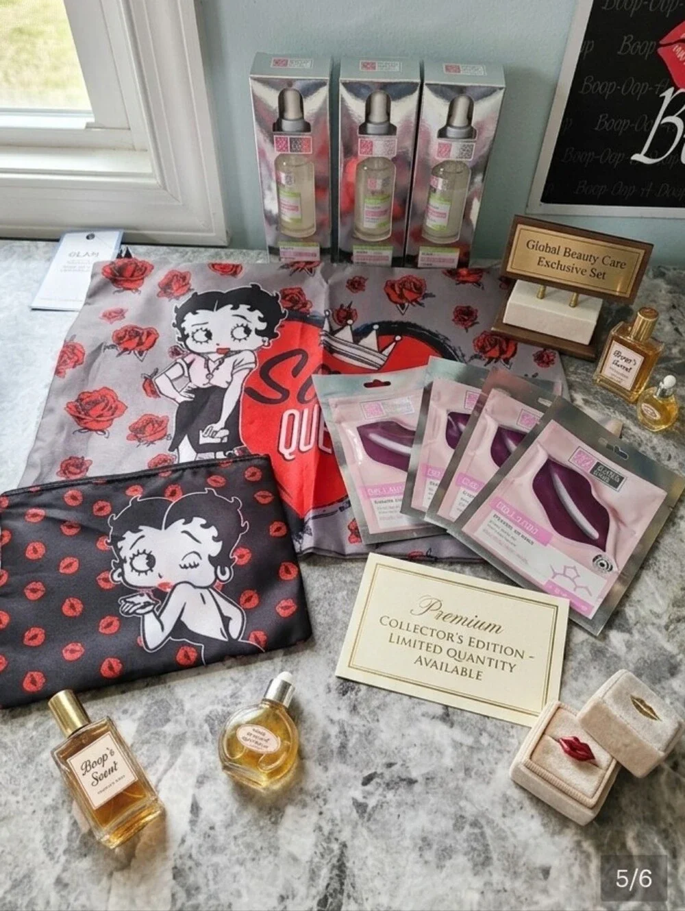 9pc Betty Boop Sassy Queen Tote, Cosmetic Pouch, 3 Serums & 4 Lip Masks!